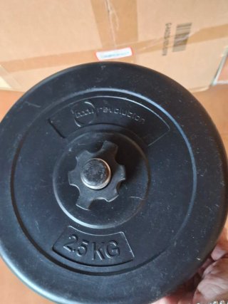 Barra y 4 pesas de 2.5 kg cada una. Para gimnasio.