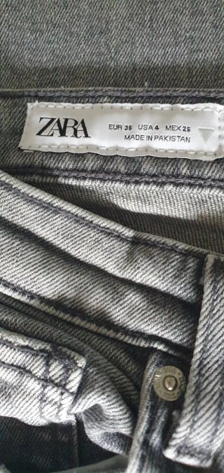 Pantalones vaqueros grises desgastados