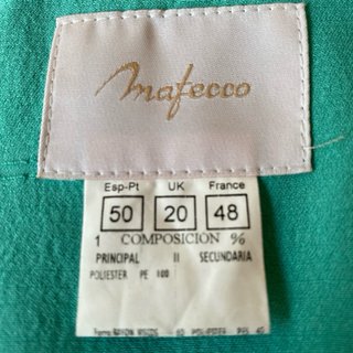 Traje chaqueta y blusa verde azulado