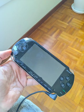 PSP 1004 + accessori + giochi