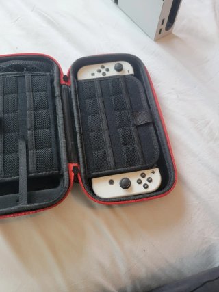 Nintendo switch OLED+Funda+Cargador+Plataforma