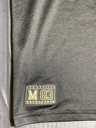 Camiseta estilo béisbol oversize negra y amarilla