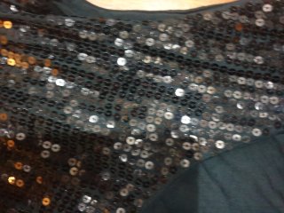 Top negro sin mangas con lentejuelas