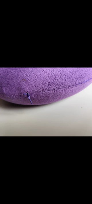 Cojín de viaje morado de forro polar nuevo sin uso