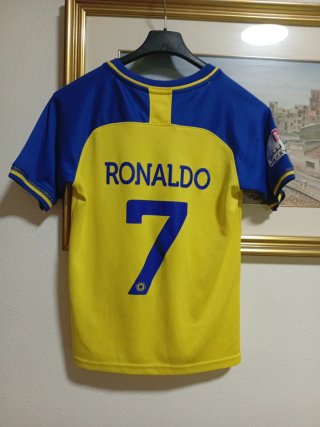 Camiseta de fútbol amarilla y azul.talla 24