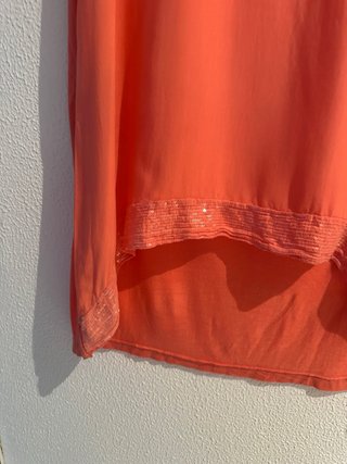 Blusa naranja con lentejuelas
