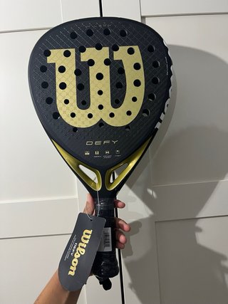 Pala Wilson Defy V1 Negra y Dorada