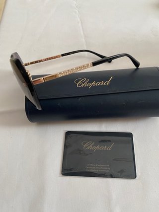 Occhiali da sole Chopard dorati e viola
