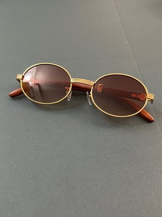 Gafas de sol ovaladas doradas y marrones