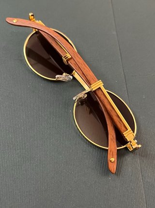 Gafas de sol ovaladas doradas y marrones