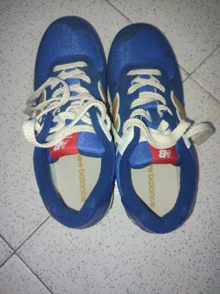 Zapatillas New Balance niño azul y dorado