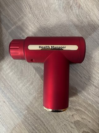 Pistola de masaje muscular