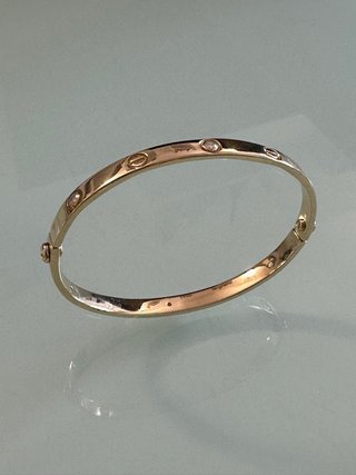 Brazalete Fabricado modelo Cartier oro18k brillant
