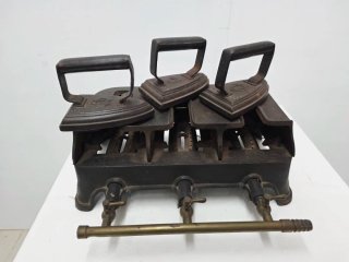 Antiguo calentador de planchas