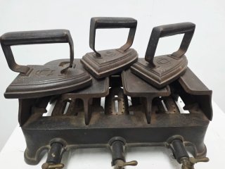 Antiguo calentador de planchas