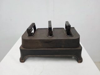 Antiguo calentador de planchas