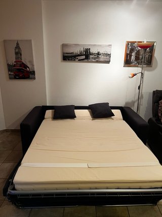 Divano letto grigio in tessuto
