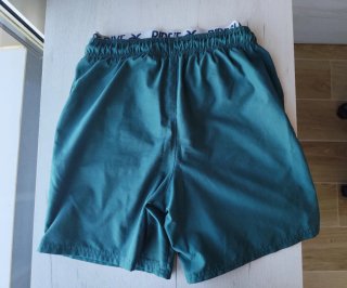 Bañador verde con logo RIDE SURF DIVE