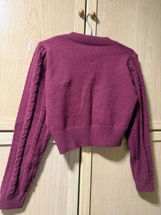 Jersey burdeos trenzado cuello pico