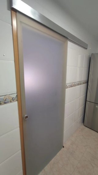 Puerta corredera de cristal