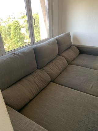 Sofá cama gris de tela