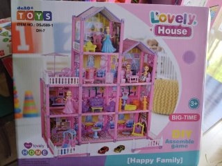Casa de muñecas de plástico rosa