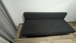 Sofá cama gris con almacenaje