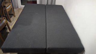 Sofá cama gris con almacenaje