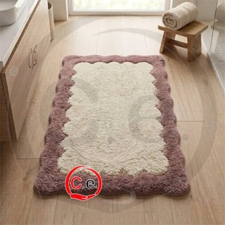 Tappeto bagno blu con bordo ondulato