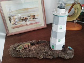Faro decorativo su legno di mare e luce led