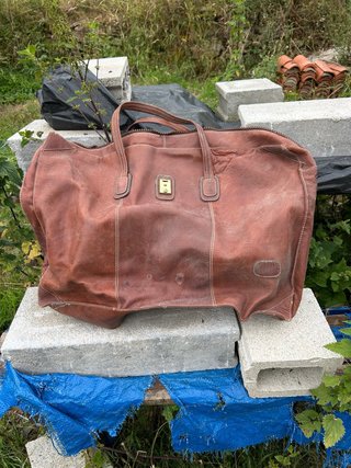 Bolsa de transporte de cuero marrón