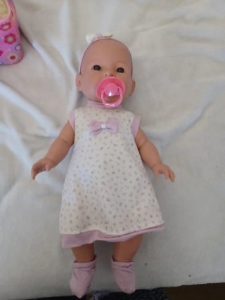 Muñeca con bolsa y accesorios de comida