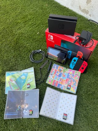Nintendo Switch + 4 juegos y accesorios