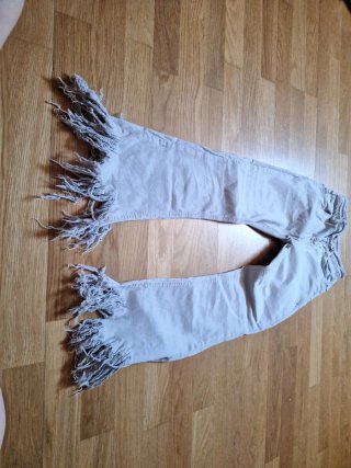 Pantalón campana beige con flecos