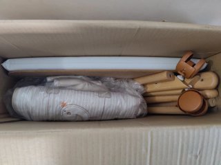 Minicuna de madera con textiles