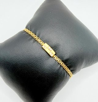 PULSERA CON PIEDRAS BLANCAS ORO 18k. Peso 3,46g