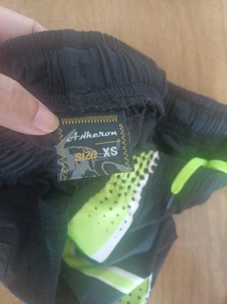 Pantalón de pádel negro y verde