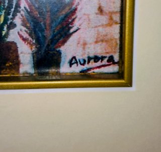 Pintura de calle con marco dorado