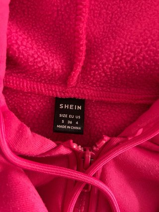 Sudadera rosa con capucha y cremallera