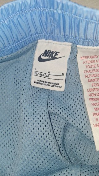 Pantalón corto Nike azul y amarillo talla L niños