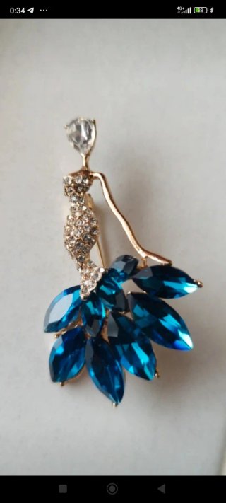 Spilla ballerina acciaio dorato con strass blu