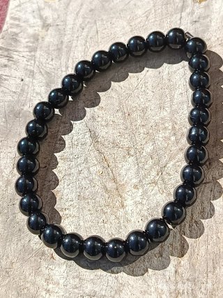 Pulsera mineral Onix con colgante de horiscopo