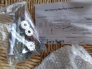 Máquina de coser de mano, a cable y a pilas