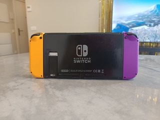 Nintendo Switch Morado y Naranja + Accesorios