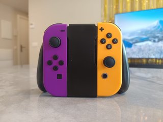 Nintendo Switch Morado y Naranja + Accesorios