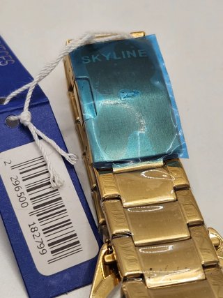 Reloj skyline acero quirúrgico chapado en oro
