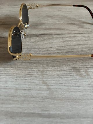 Óculos de sol Miu Miu dourados