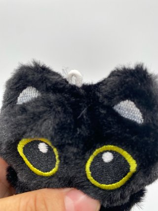 Peluche gato negro ojos grandes
