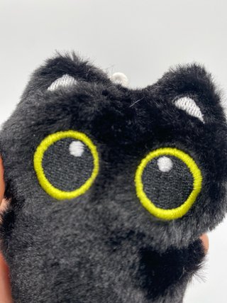 Peluche gato negro ojos grandes