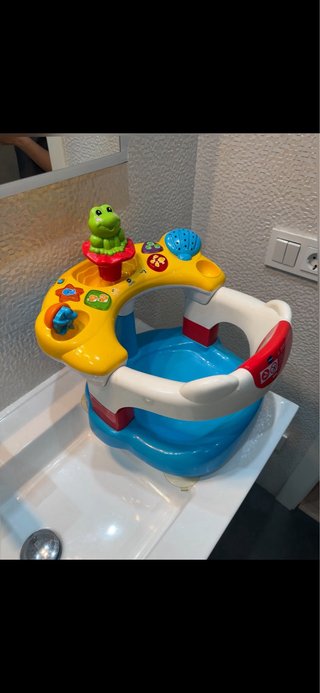 Asiento de baño para bebé con juguetes